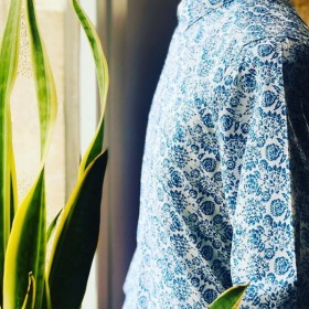 White men's shirt with blue...